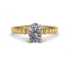 Diamante ovalado en anillo de oro amarillo de 18 quilates con cuentas