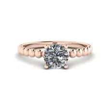 Solitario de diamantes redondos en anillo con cuentas en oro rosado