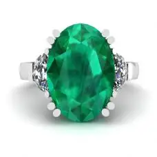 Anillo de esmeralda ovalada con diamantes laterales en forma de media luna